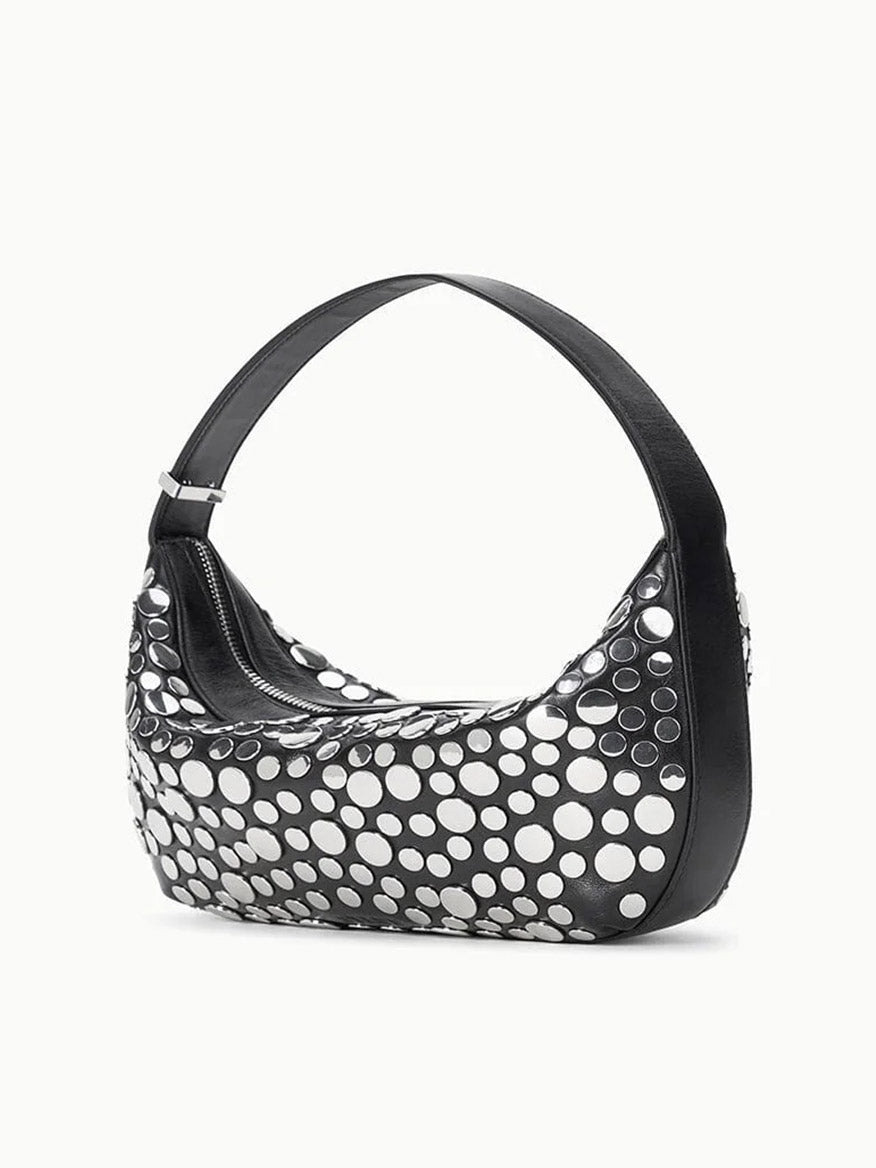 The STAUD Demy Shoulder Bag in Rivets showcases a curved silhouette in smooth nappa leather with shiny silver circular studs accenting the front and sides.