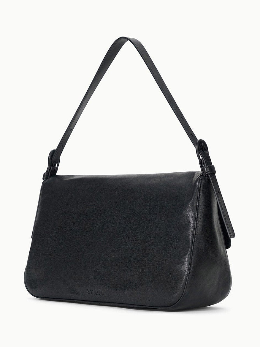 The STAUD Harlow Medium Bag in Black is a rectangular, smooth leather shoulder bag with a single strap and signature Moon buckle, shown against a plain white background.