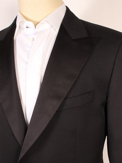 Close-up of a mannequin dressed in a Scabal Black Satin Trim Super 100s tuxedo and white shirt.