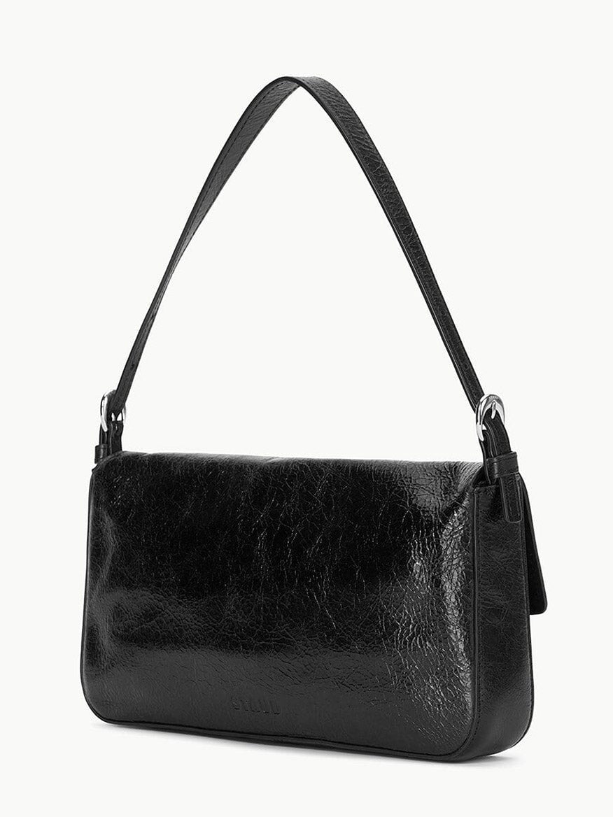 The STAUD Harlow Bag in Black is a rectangular crinkle leather shoulder bag with a single strap, shown against a plain white background.
