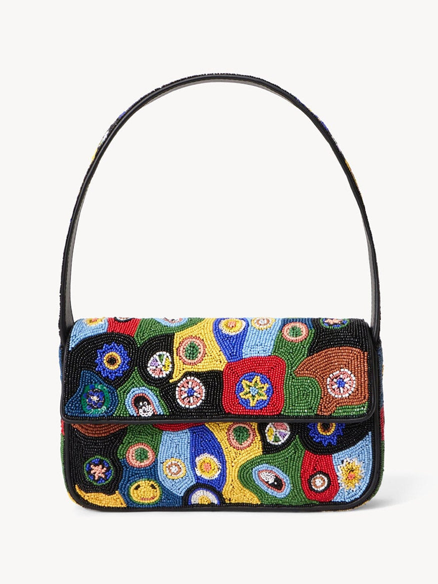 The STAUD Tommy Beaded Bag in Black Millefiori is a rectangular shoulder bag with a black strap and features a vibrant beaded design of abstract multicolored circular patterns.
