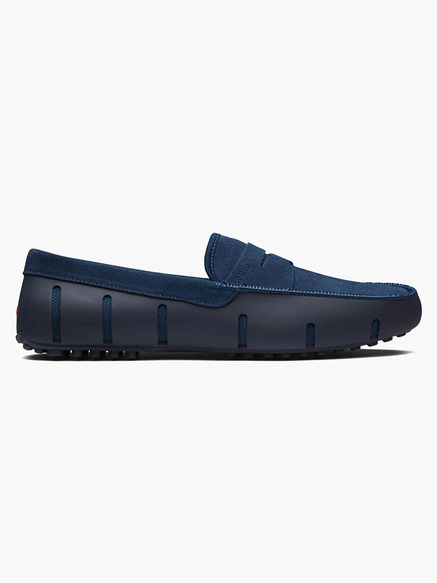 Side view of the Swims Lux Driver in Midnight Navy, a suede loafer featuring a textured sole, algae-based footbed, and a sleek, seamless design.