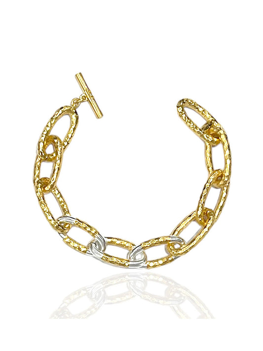 Tat2 Designs Eli Hammered Chain Bracelet in Gold Two-Tone features sterling silver-plated and textured 14K gold-plated links with a custom toggle closure, shown on a white background.