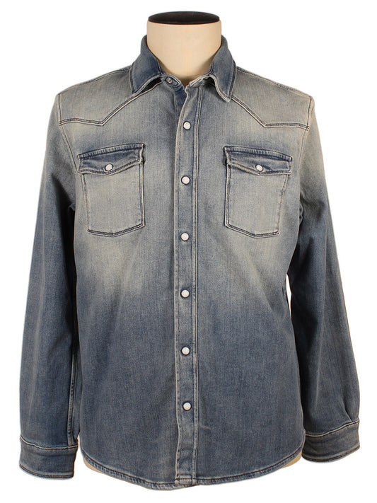 A Teleria Zed Roper Western Snap Shirt in Mid Light Blue with pearlized snaps closures and two chest pockets displayed on a mannequin.