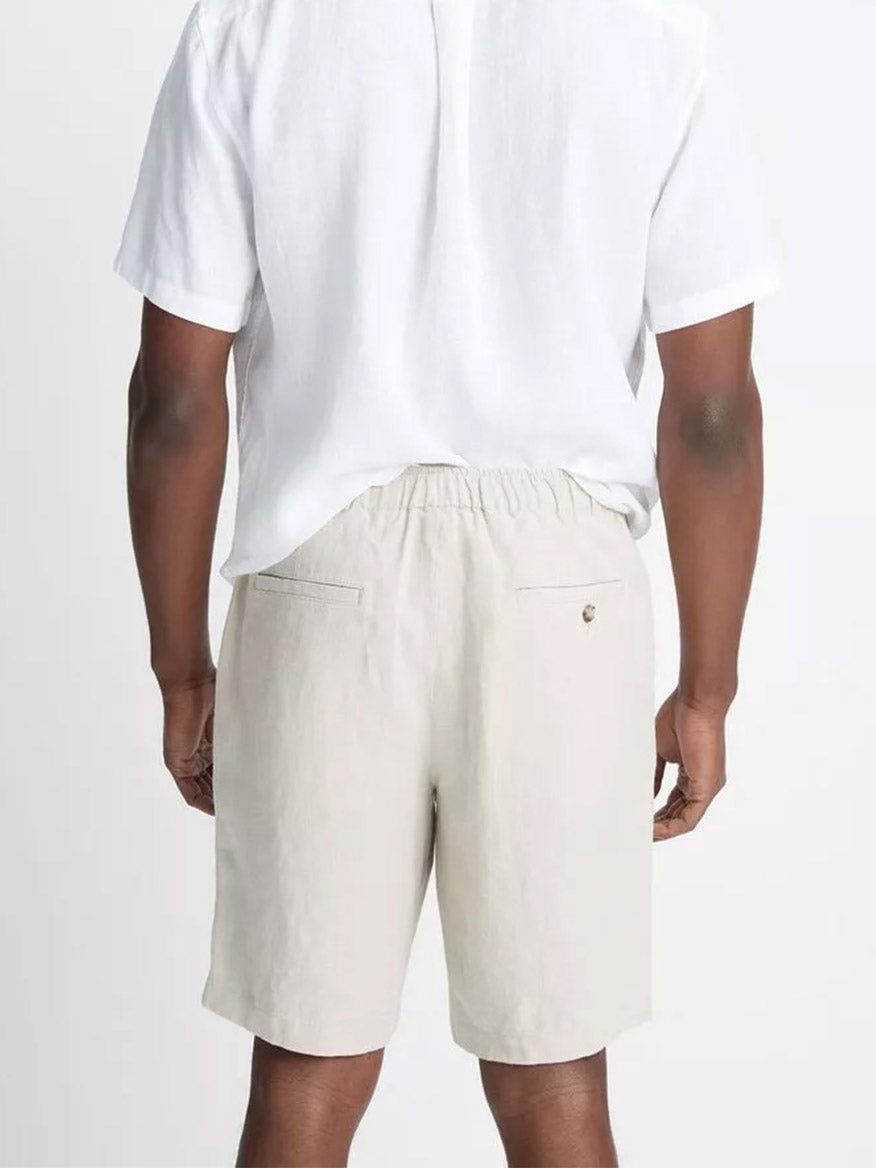 Back view of a person wearing Vince Lightweight Hemp Short in Pumice Rock and a white t-shirt.