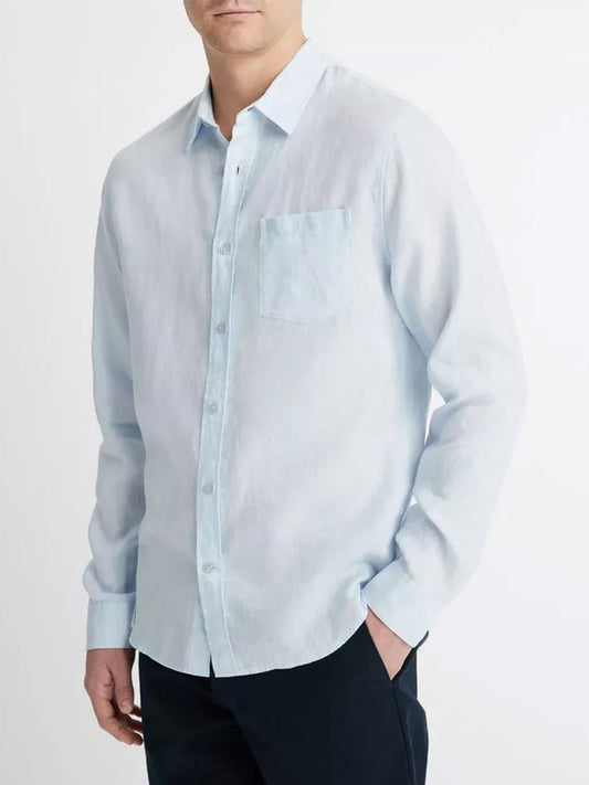 Man wearing a Vince Linen Long Sleeve Shirt in Glacier with a chest pocket.