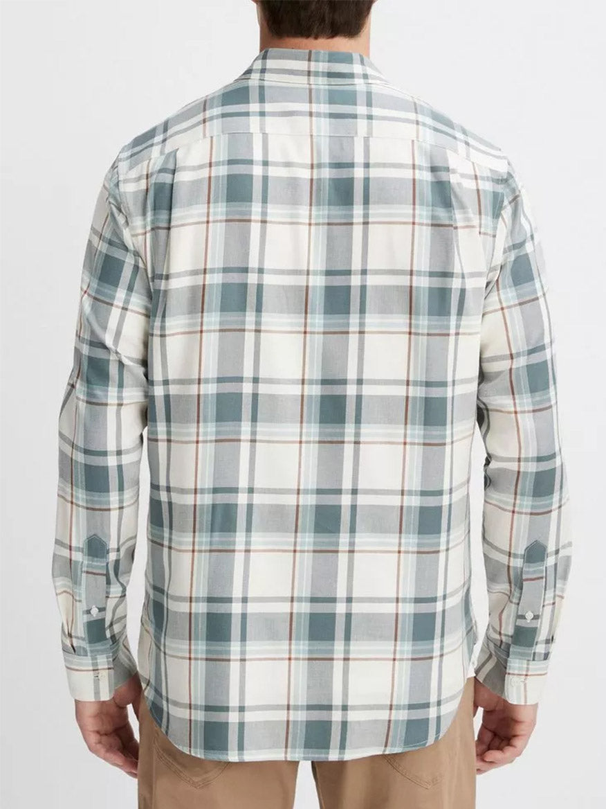 A person wearing a Vince Manchester Plaid Shirt in Bone/Dusty Teal and beige pants is shown from the back.