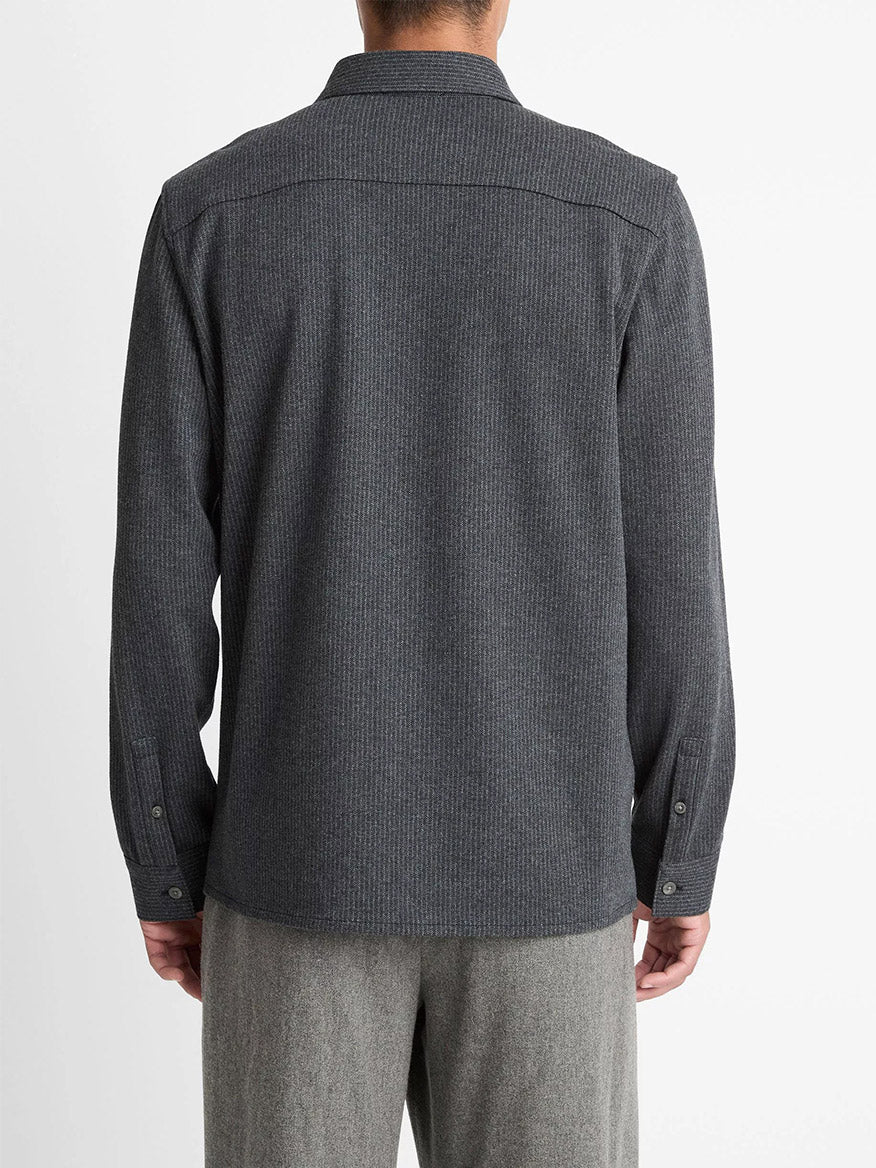 A person is seen from the back wearing a Vince Pinstripe Jacquard Cotton-Blend Button-Front Shirt in Charcoal with light gray pants against a white background.