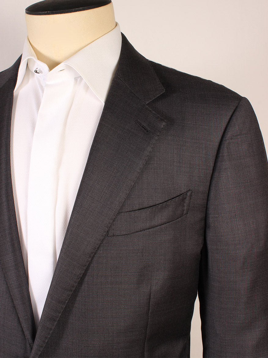 A mannequin dressed in the Zegna TicWeave Charcoal Trofeo™ Wool Suit, paired with a white dress shirt and white tie, stands against a plain background.