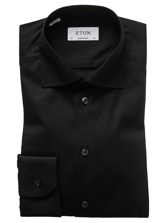 A neatly folded Eton Contemporary Fit Black Signature Twill Dress Shirt with a tag indicating the brand name Eton and the size 37 contemporary fit. This wrinkle-free shirt features a classic collar and buttons down the front and on the cuffs.