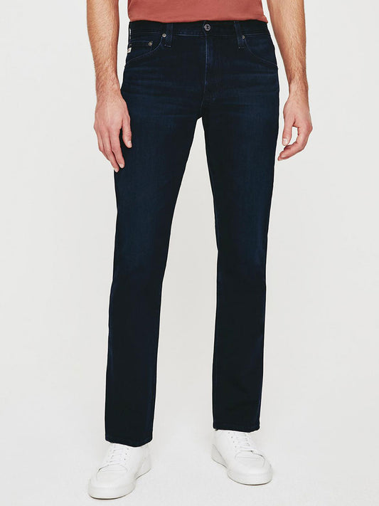 A man wearing AG Jeans Everett in Bundled slim straight jeans.
