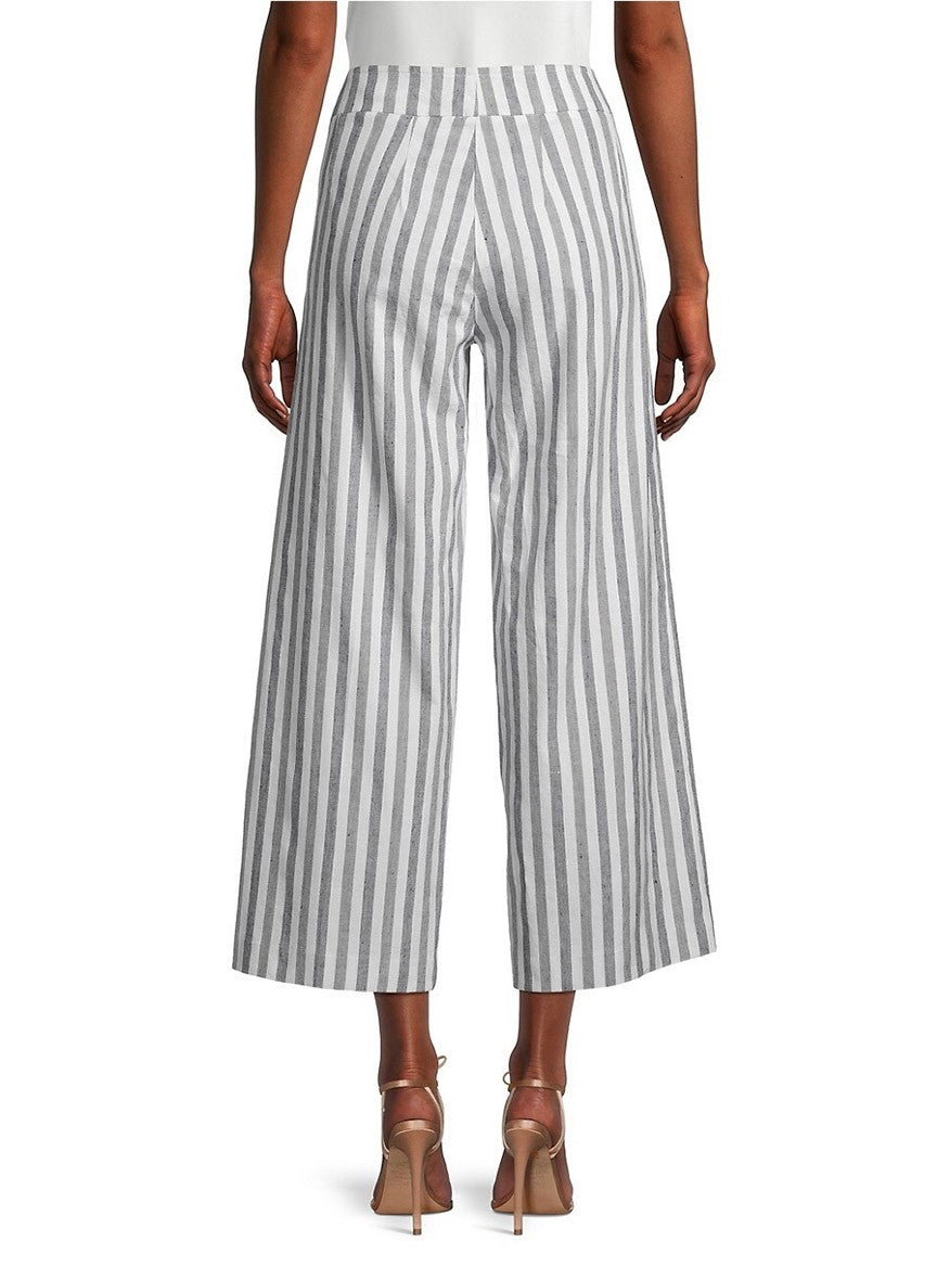A woman wearing Avenue Montaigne Alex Ankle Crop Pant in Coastal Stripe and tan high heels.