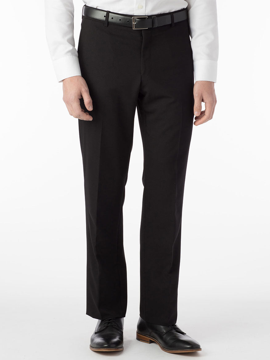 A man wearing Ballin Connor Comfort 'EZE' Modern Flat Front Pant in Black made of gabardine fabric and paired with a crisp white shirt.