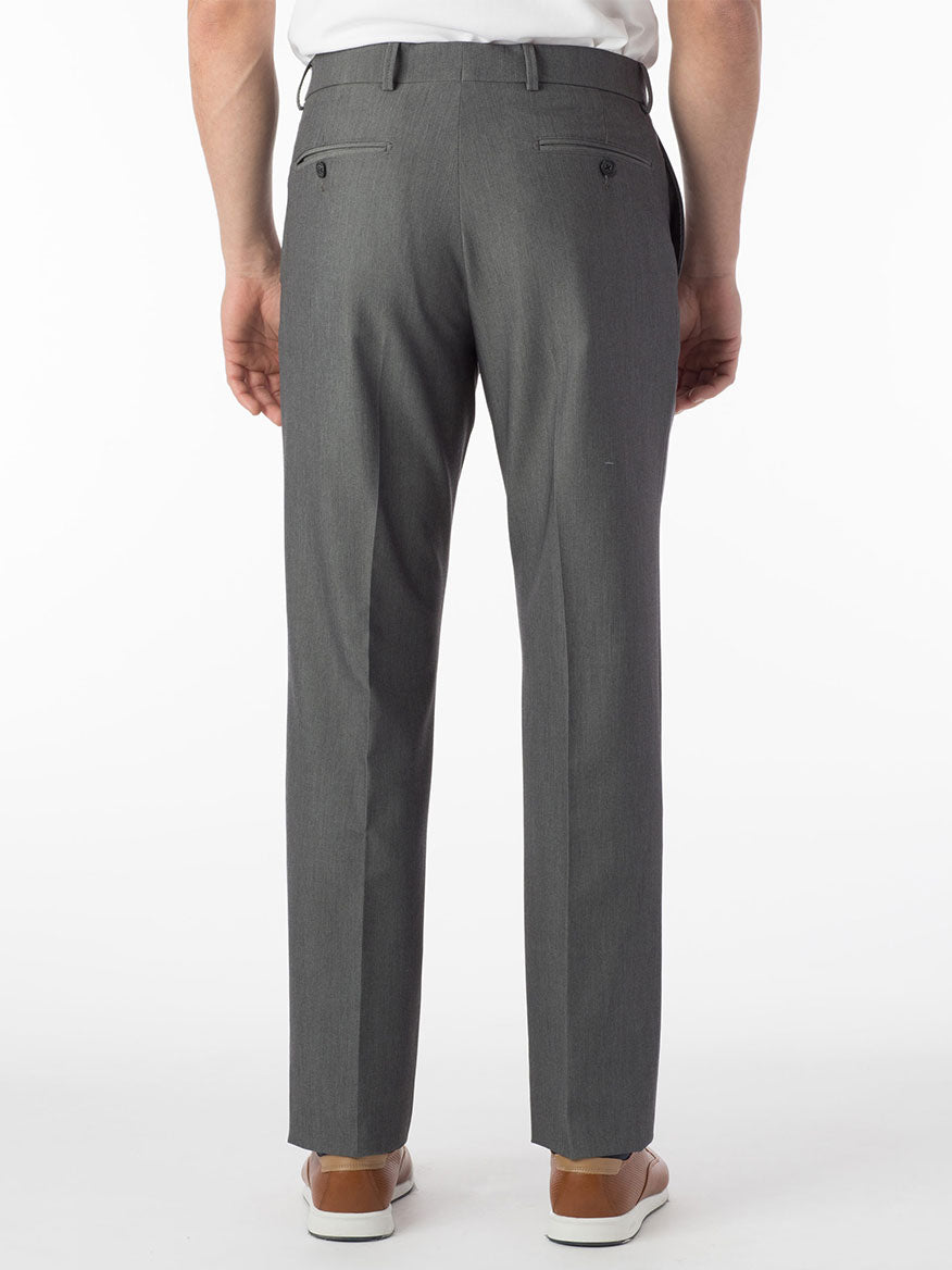 The back view of a man wearing Ballin Connor Comfort 'EZE' Modern Flat Front Pant in Mid Grey, made of bi-stretch fully synthetic gabardine. The pants feature a Comfort "EZE" waistband and are washable.