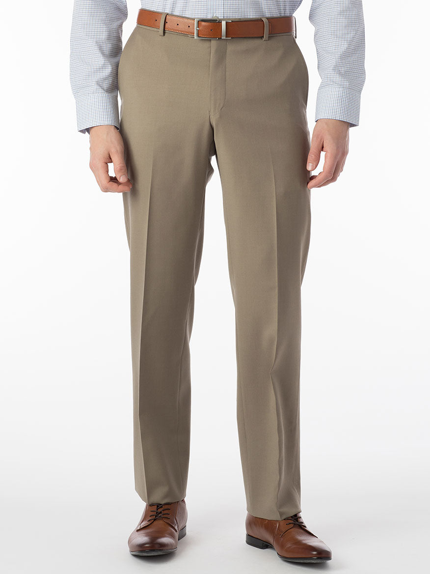 A man wearing Ballin Theo Comfort 'EZE' Modern Flat Front Pant in British Tan dress pants made of wool gabardine with a matching tan shirt featuring silk protein.