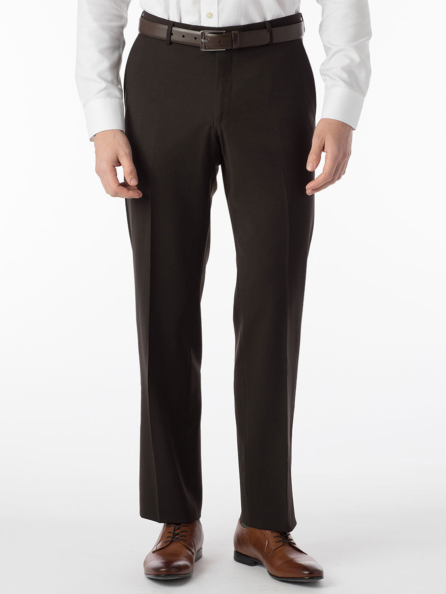 A man wearing the Ballin Theo Comfort 'EZE' Modern Flat Front Pant in Brown made of wool gabardine and a white shirt.