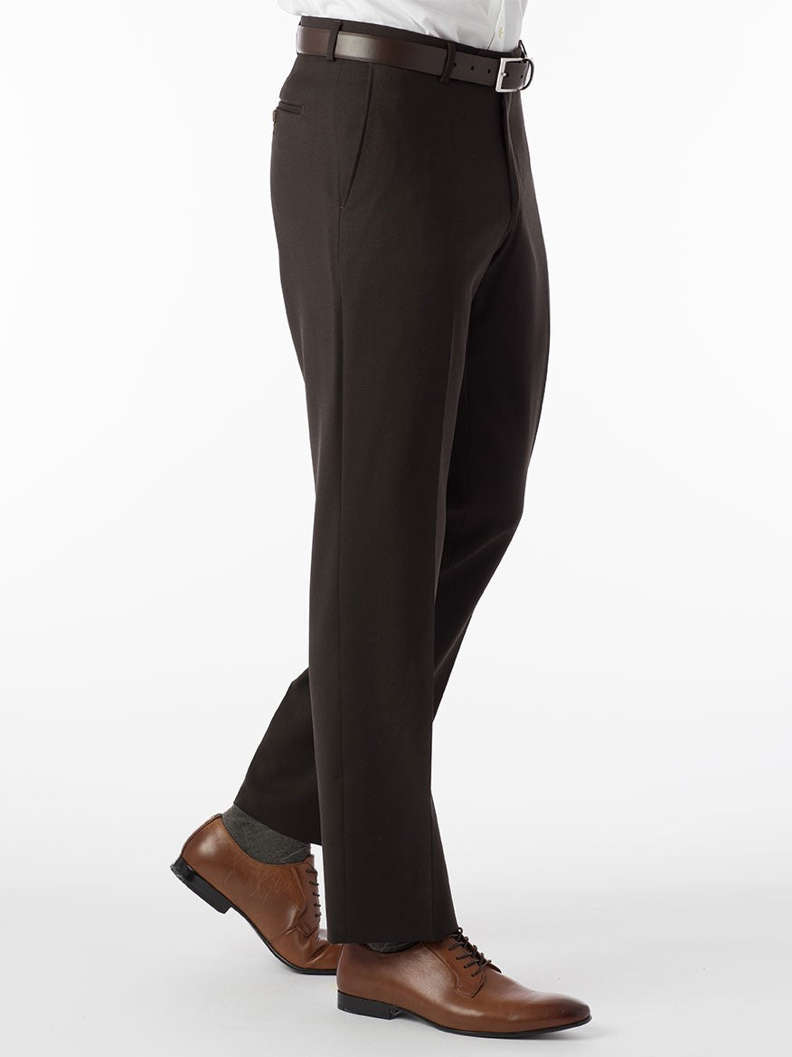 A man wearing Ballin Theo Comfort 'EZE' Modern Flat Front Pant in Brown wool gabardine dress pants and a white silk protein shirt.