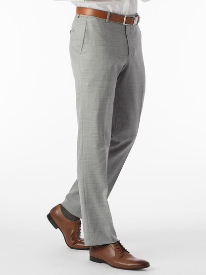 A man in a Ballin Soho Comfort 'EZE' Super 120s Modern Flat Front Pant in Light Grey is standing on a white background.