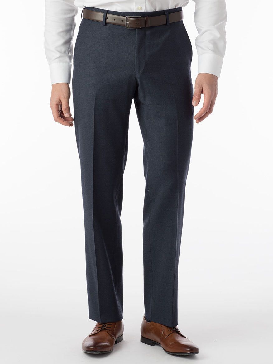 A man dressed in blue Ballin Soho Comfort 'EZE' Super 120s Modern Flat Front Pant in Navy Mix made of Super 120's serge fabric is standing.