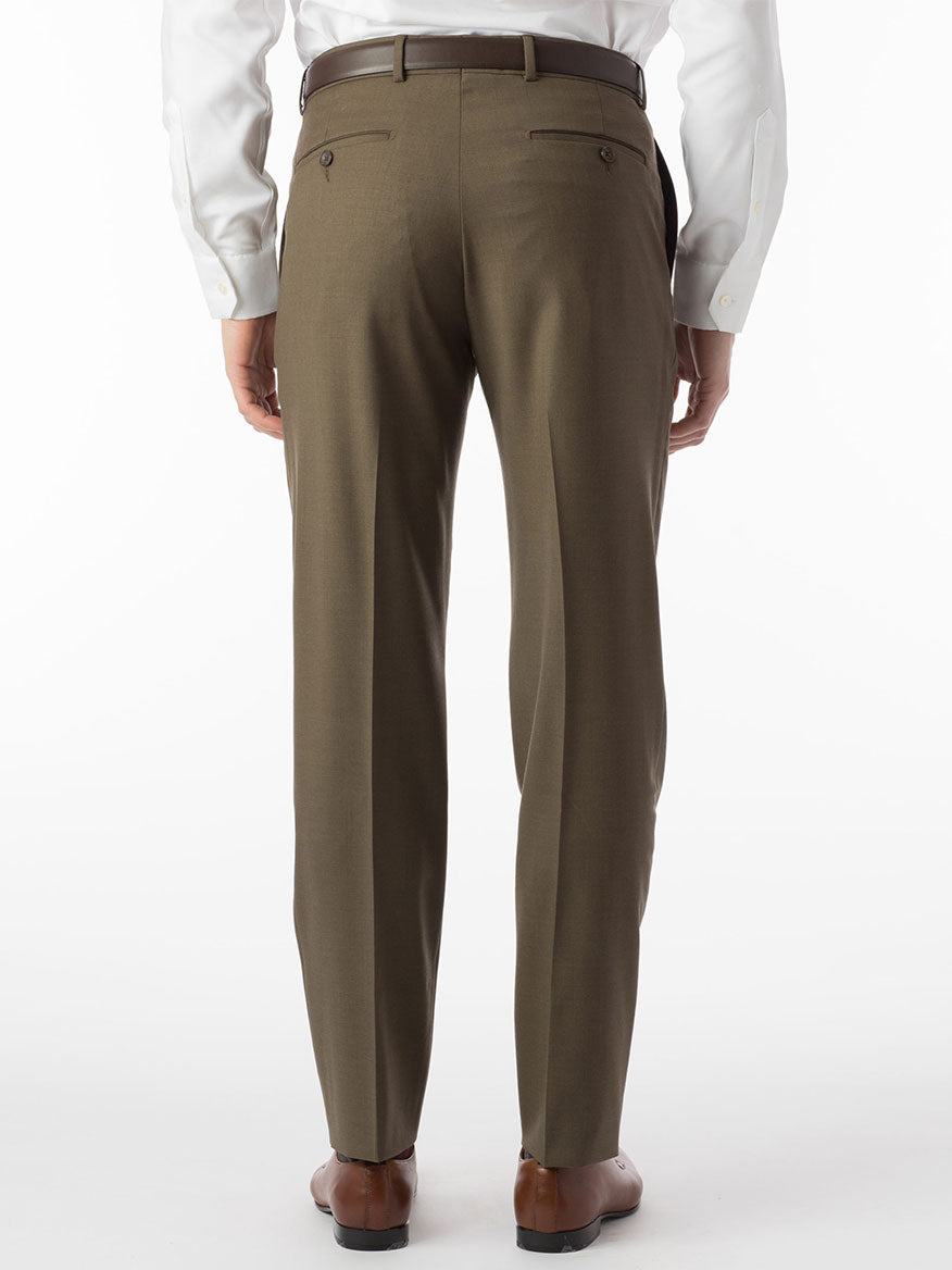 The back view of a man wearing the Ballin Soho Comfort 'EZE' Super 120s Modern Flat Front Pant in Olive and a white shirt exhibits both comfort and style.