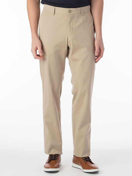 A man wearing Ballin Atwater True Khaki Modern Flat Front Pant in Khaki and a black shirt.