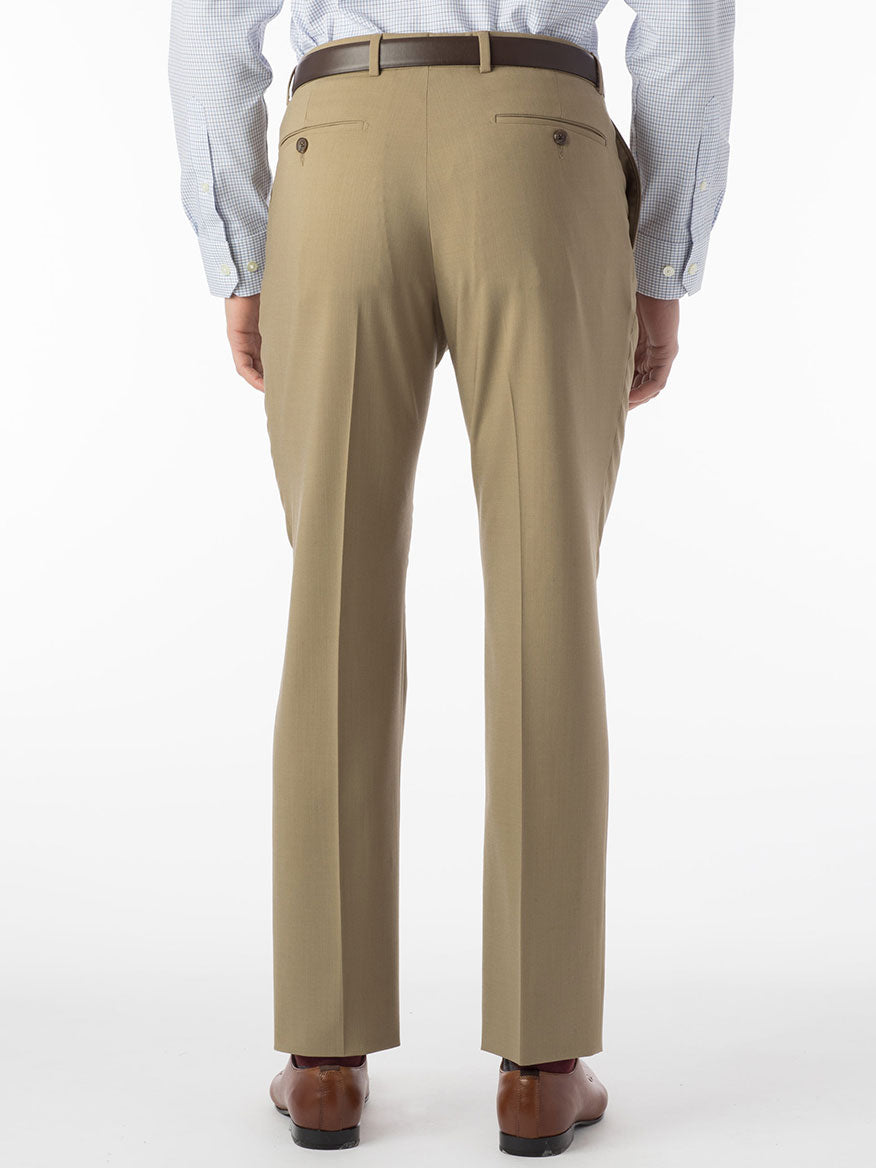 A person seen from the back wears Ballin Soho Comfort 'EZE' Super 120s Modern Flat Front Twill Pant in Sand, paired with a light blue checkered shirt and brown shoes.