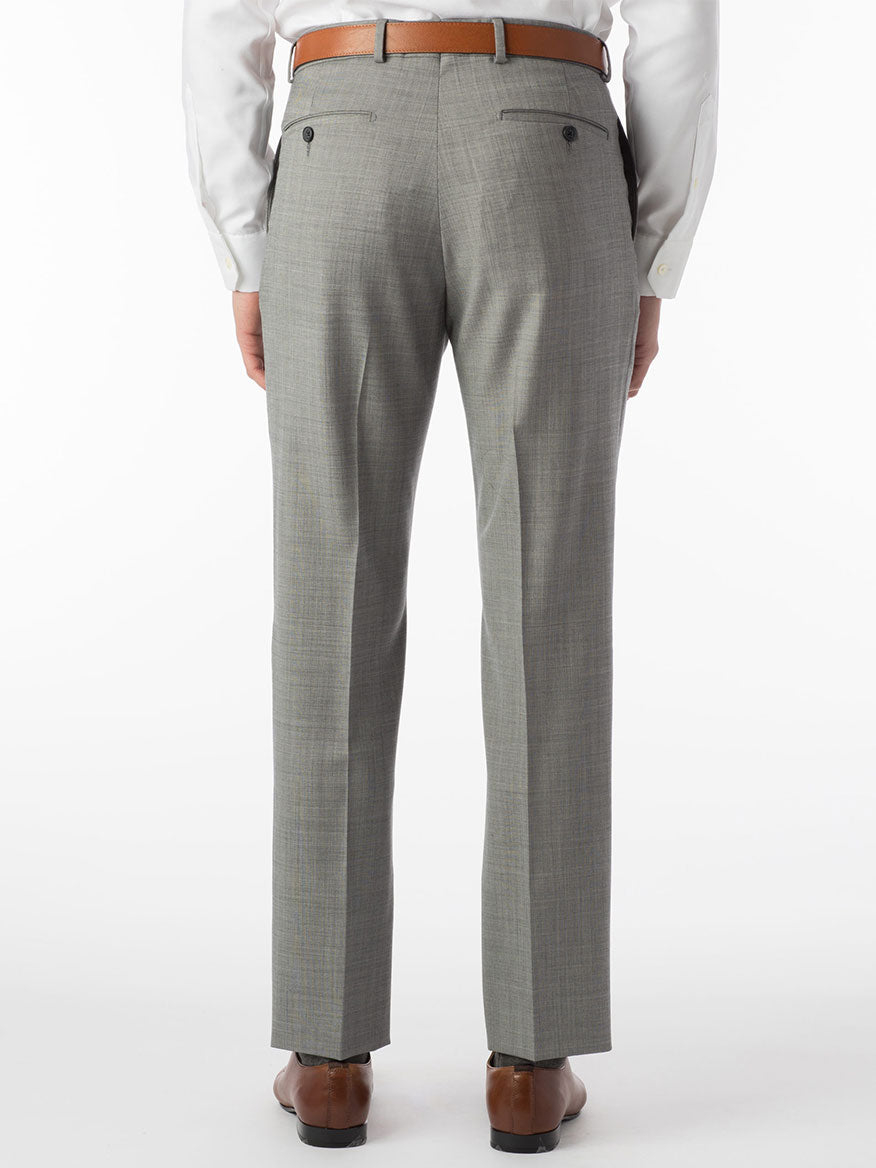 The rear view showcases a person wearing the Ballin Soho Comfort 'EZE' Sharkskin Modern Flat Front Pant in Houndstooth, paired with a white shirt and brown belt. The Comfort EZE construction of the pants offers effortless movement. Completing the outfit, brown shoes subtly emerge at the bottom, harmonizing perfectly with the ensemble.