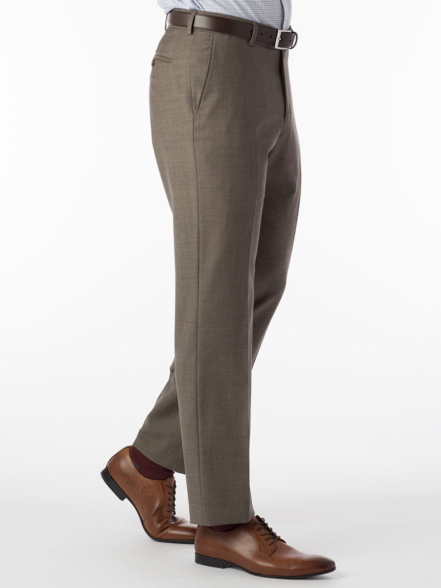 A man wearing Ballin Soho Comfort 'EZE' Sharkskin Modern Flat Front Pant in Light Brown hybrid dress pants with worsted wool material.