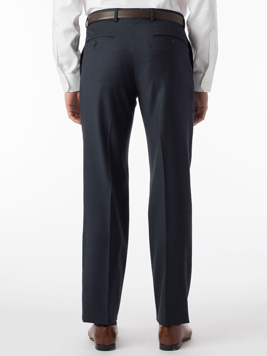 The back view of a man wearing Ballin Soho Comfort 'EZE' Sharkskin Modern Flat Front Pant in Navy made with construction and crafted from worsted wool.