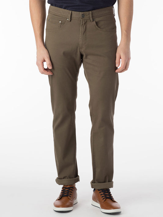 A man wearing Ballin Crescent Modern 5 Pocket Twill Pants in Fatigue and a black shirt.