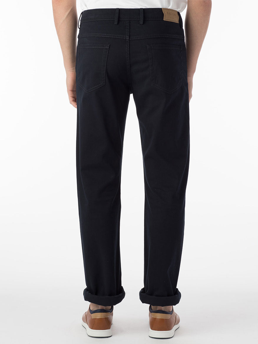 The back view of a man wearing Ballin Crescent Modern 5 Pocket Twill Pants in Navy.