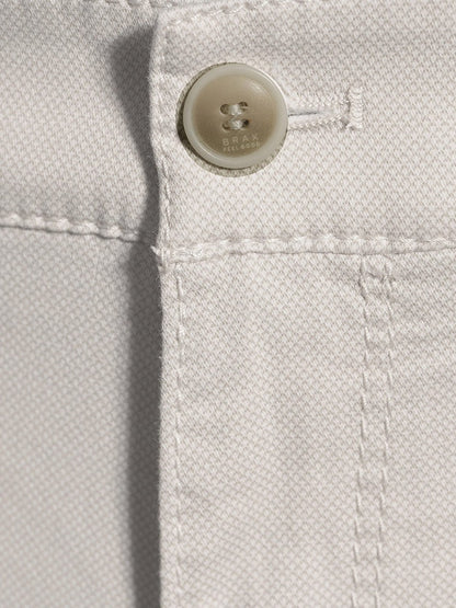 Close-up of a Brax Bari Triplestone Printed Modern Fit Short in Sand with detailed stitching and a button.