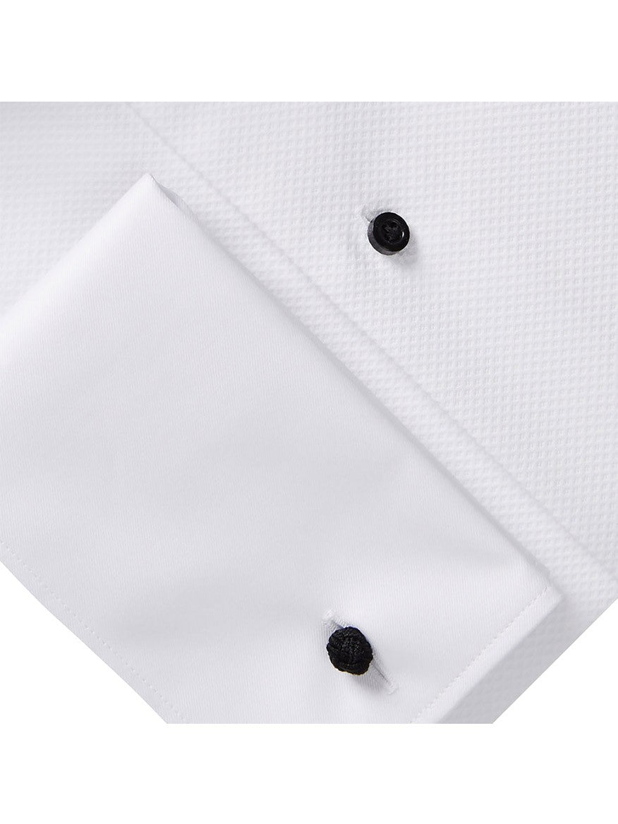 Close-up of the Emanuel Berg Formal Dress Shirt in White Mr. Crown Collar, featuring black cufflinks attached to the French cuffs. The wrinkle-resistant fabric boasts a textured pattern.