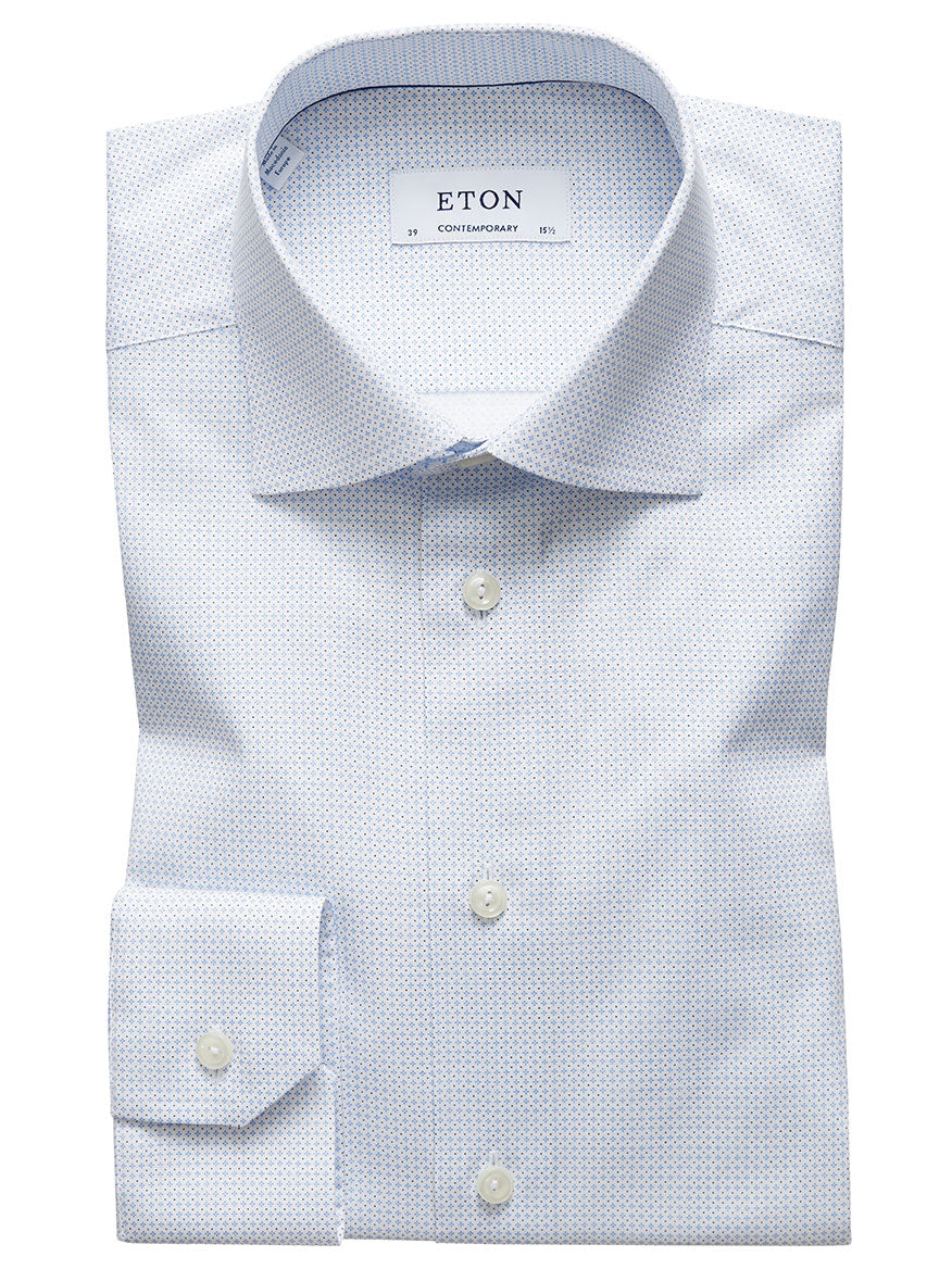 A neatly folded Eton Contemporary Fit Sky Blue Micro Print Dress Shirt displayed on a white background. Made from Eton's fine poplin fabric, the label inside reads "ETON," and the size information is visible on the collar—truly a timeless wardrobe staple.