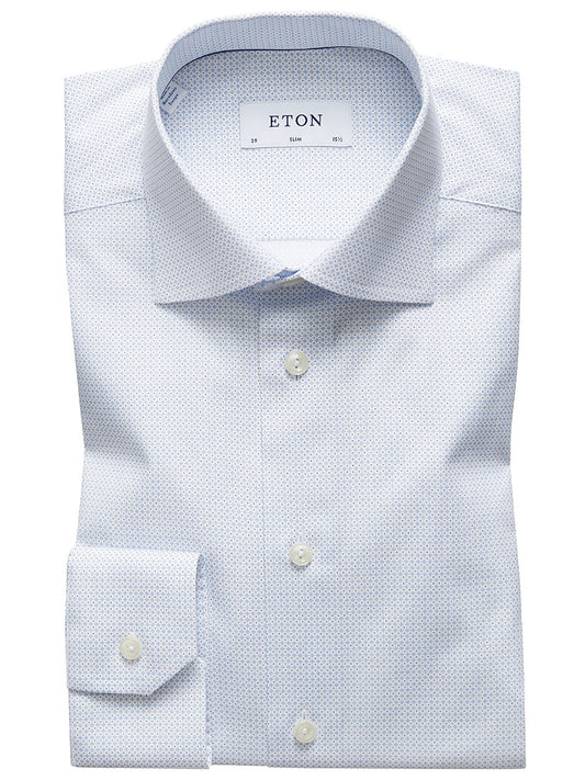 A neatly folded sky blue dress shirt with a micro print pattern, crafted from poplin fabric. The label reads "ETON," and the slim fit style ensures a sharp, tailored look.