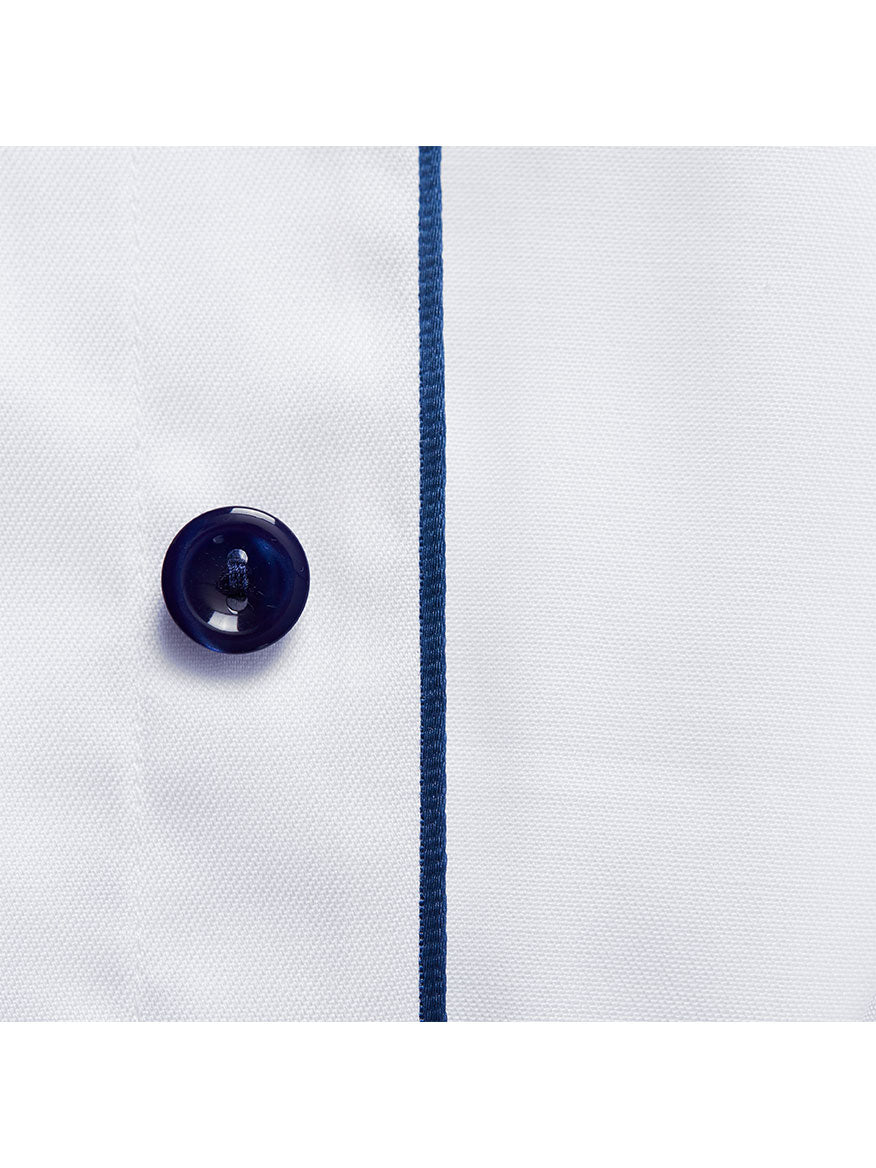 Close-up of the Eton Slim Fit White Twill Dress Shirt with navy details, showcasing a dark blue button and parallel navy stitched line.