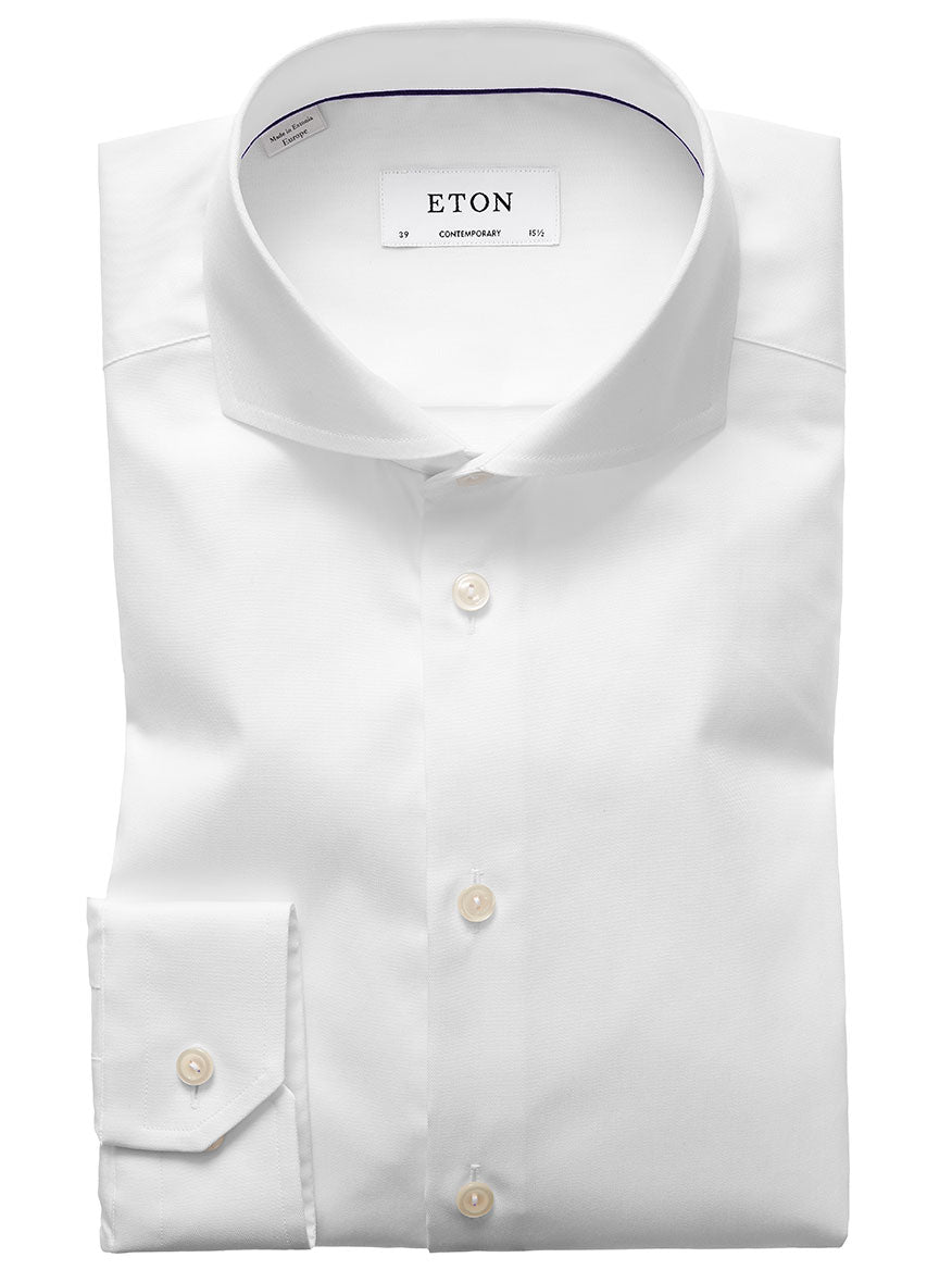 A neatly folded Eton Contemporary Fit White Extreme Cut Away Dress Shirt with a label displaying the brand "ETON" and "contemporary" in the collar, crafted from signature twill fabric for a wrinkle-free shirt, perfect for achieving a polished business look.