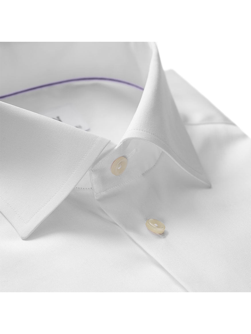 Close-up of a neatly folded Eton Contemporary Fit White Signature Twill Dress Shirt, highlighting its modern fit. Featuring a visible collar and buttons, this versatile shirt is crafted from wrinkle-free fabric, making it perfect for any occasion and ensuring effortless style.