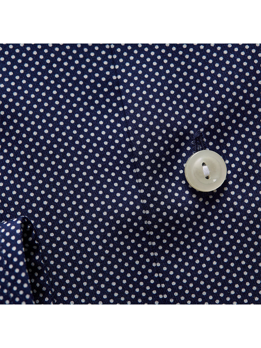 Close-up of a navy blue fabric with a white polka dot pattern, featuring a white button attached to a stitched buttonhole, suitable for designs with an Eton Contemporary Fit Eton Signature Dots Dress Shirt.
