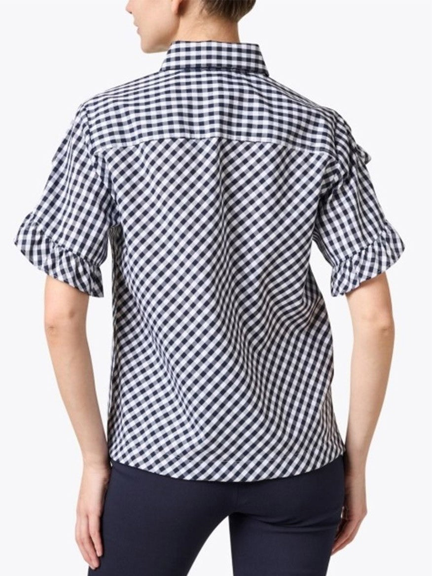 A woman from behind wearing a Hinson Wu Lulu Short Sleeve Mini Gingham Shirt in Navy/White with rolled-up sleeves.