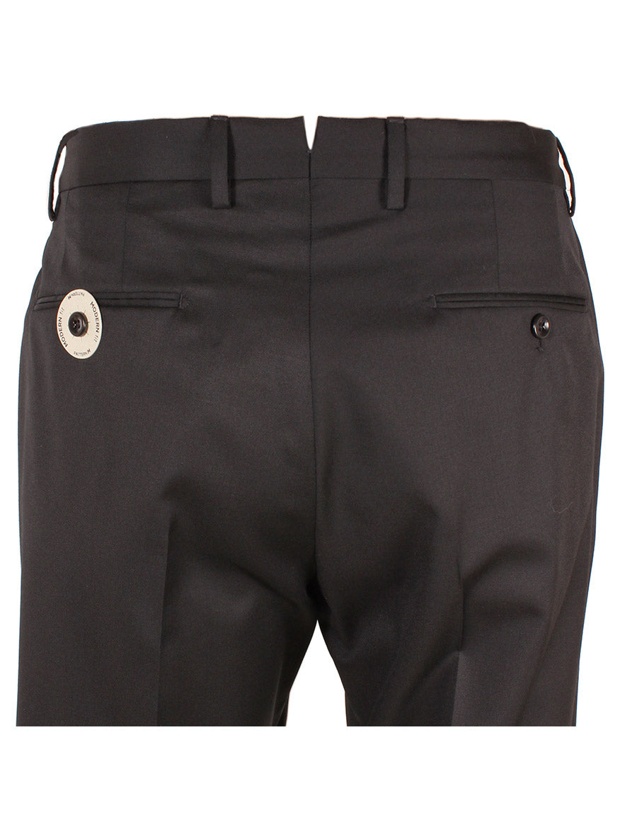 Rear view of the Incotex Matty 4-Season Trouser in Black, featuring buttoned back pockets and belt loops. Made from premium Super 100s Batavia wool, these pants offer versatile elegance. A security tag is attached to the left side.