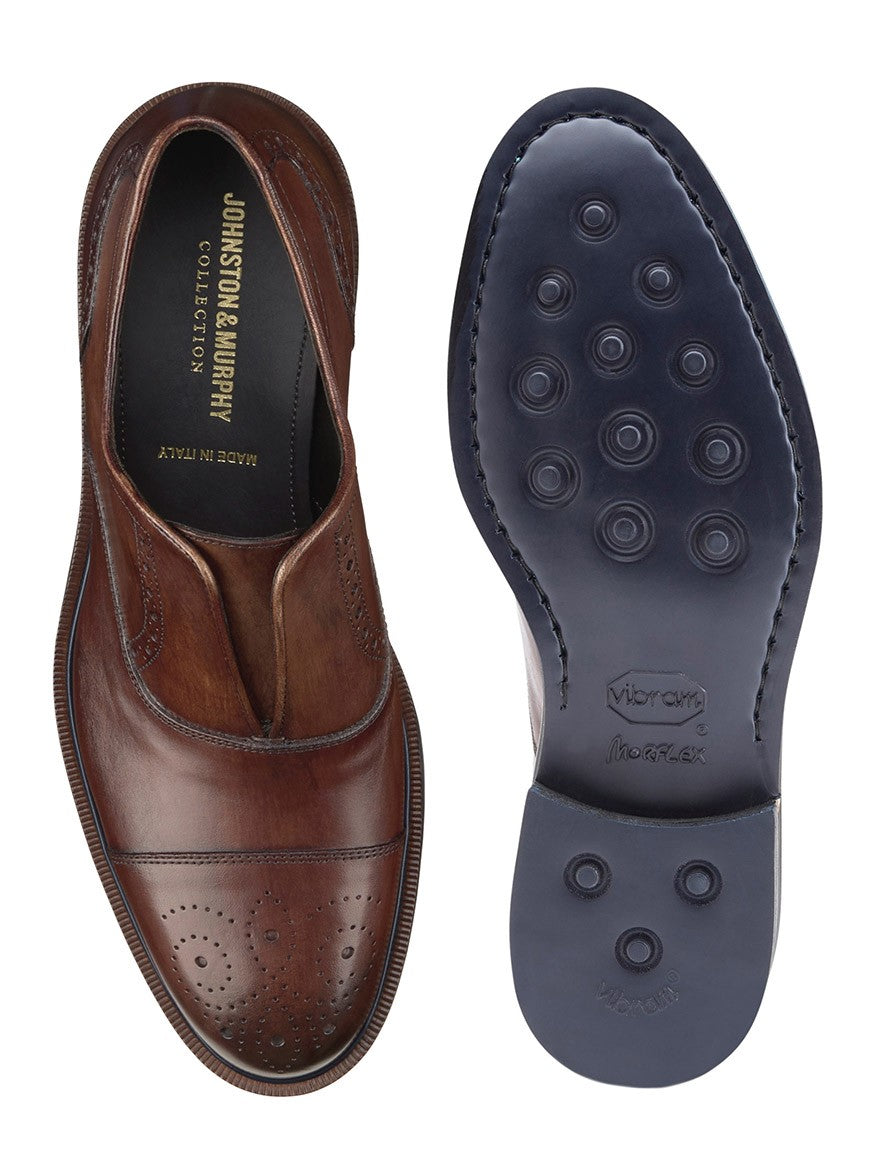 A pair of J & M Collection Hartley Laceless Cap Toe in Brown Italian Calfskin shoes with blue soles.