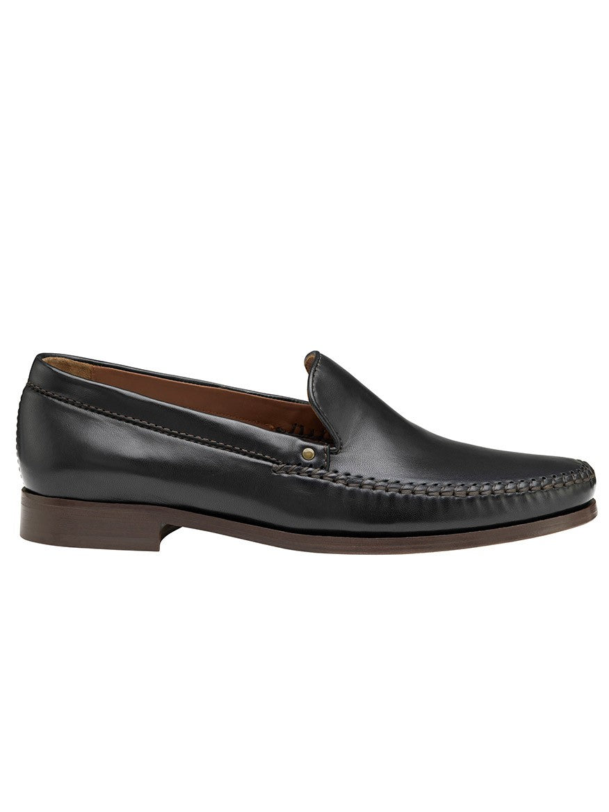 A men's J & M Collection Baldwin Whipstitch Venetian in Black Sheepskin on a white background.
