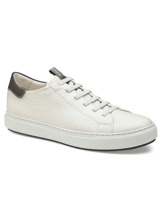 A pair of J & M Collection Anson Lace-to-Toe sneakers in white sheepskin with grey trim, featuring white laces, a black heel tab detail, and a flexible EVA sole that offers modern cushioning.