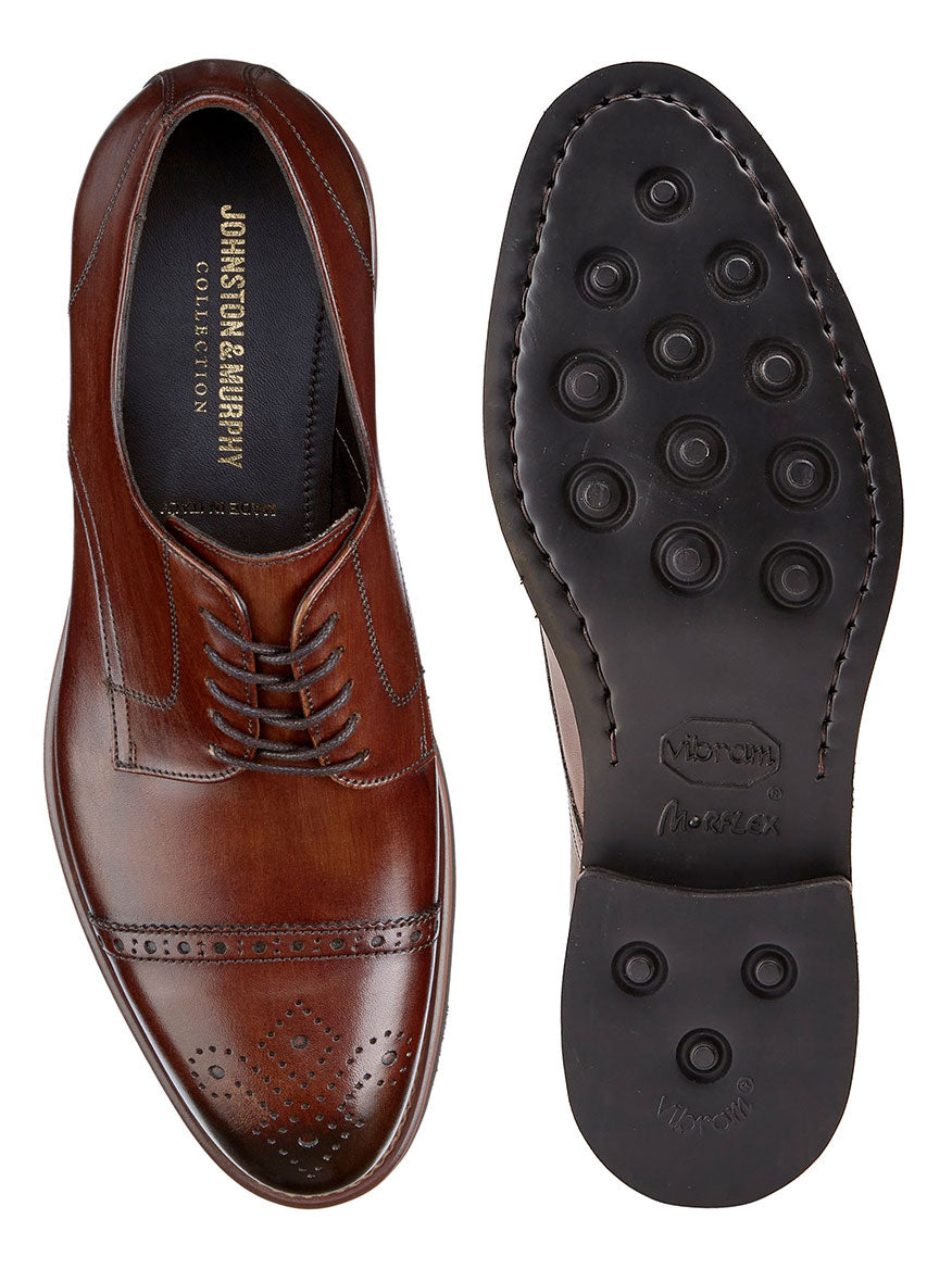 A pair of J & M Collection Ashford Cap Toe in Brown Italian Calfskin Oxford shoes with brogue detailing, displayed side by side showing the top and Vibram EVA sole.
