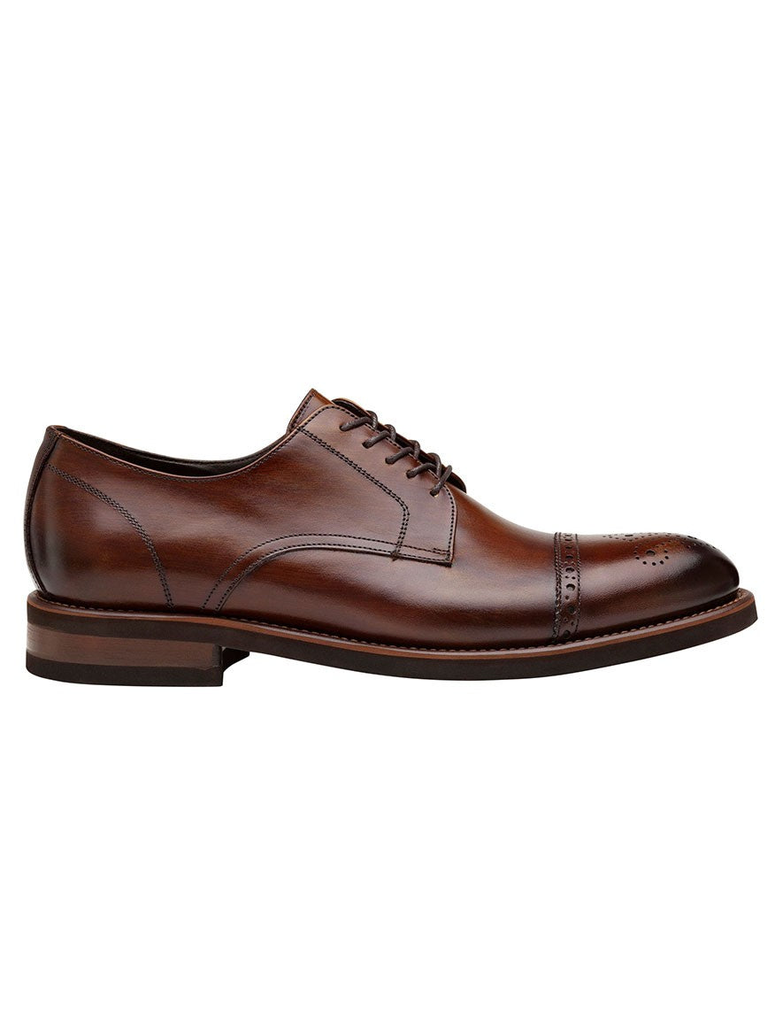 A single J & M Collection Ashford Cap Toe in Brown Italian Calfskin leather oxford shoe with detailed stitching and perforations, viewed from the side on a white background.