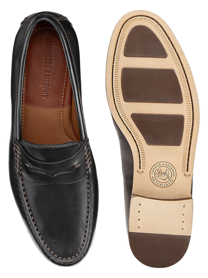 A pair of J & M Collection Baldwin Penny loafers in Black Sheepskin with a cushioned footbed and sheepskin leather.