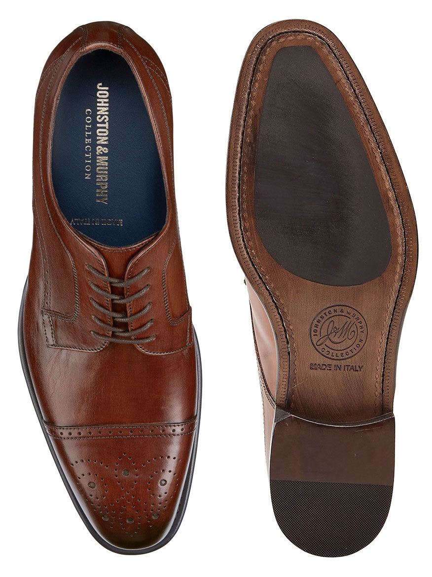 Top view of a pair of J & M Collection Ellsworth Cap Toe in Brown Italian Calfskin dress shoes with decorative perforations and embossed soles.