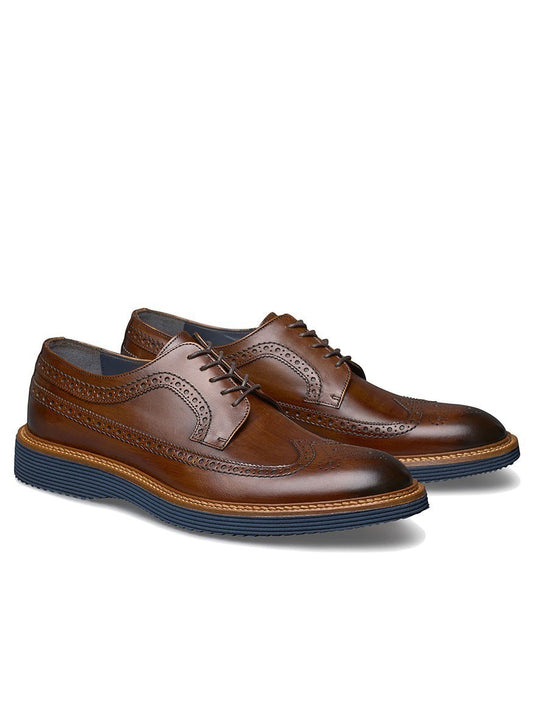 A pair of J & M Collection Jameson Wingtip in Brown Italian Calfskin, crafted in Italy with blue soles.