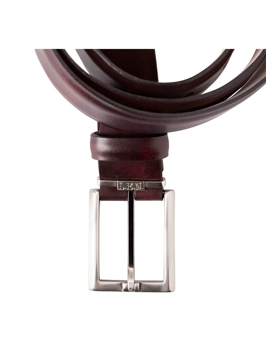 An Italian marbled calf belt in plum, handcrafted in the USA, featuring a silver rectangular buckle.